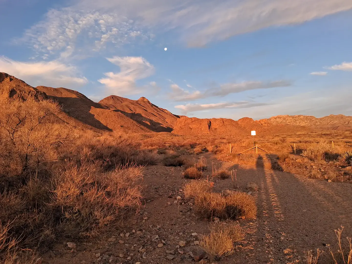 The Franklin Mountains in Northeast El Paso, lit orange by the low sun